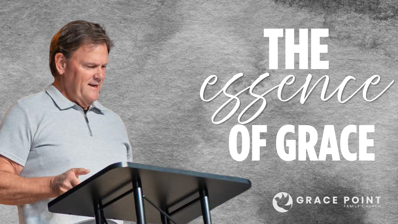 Speaker at a podium delivering a sermon; banner reads 'The essence of grace' with Grace Point Church logo in the corner.